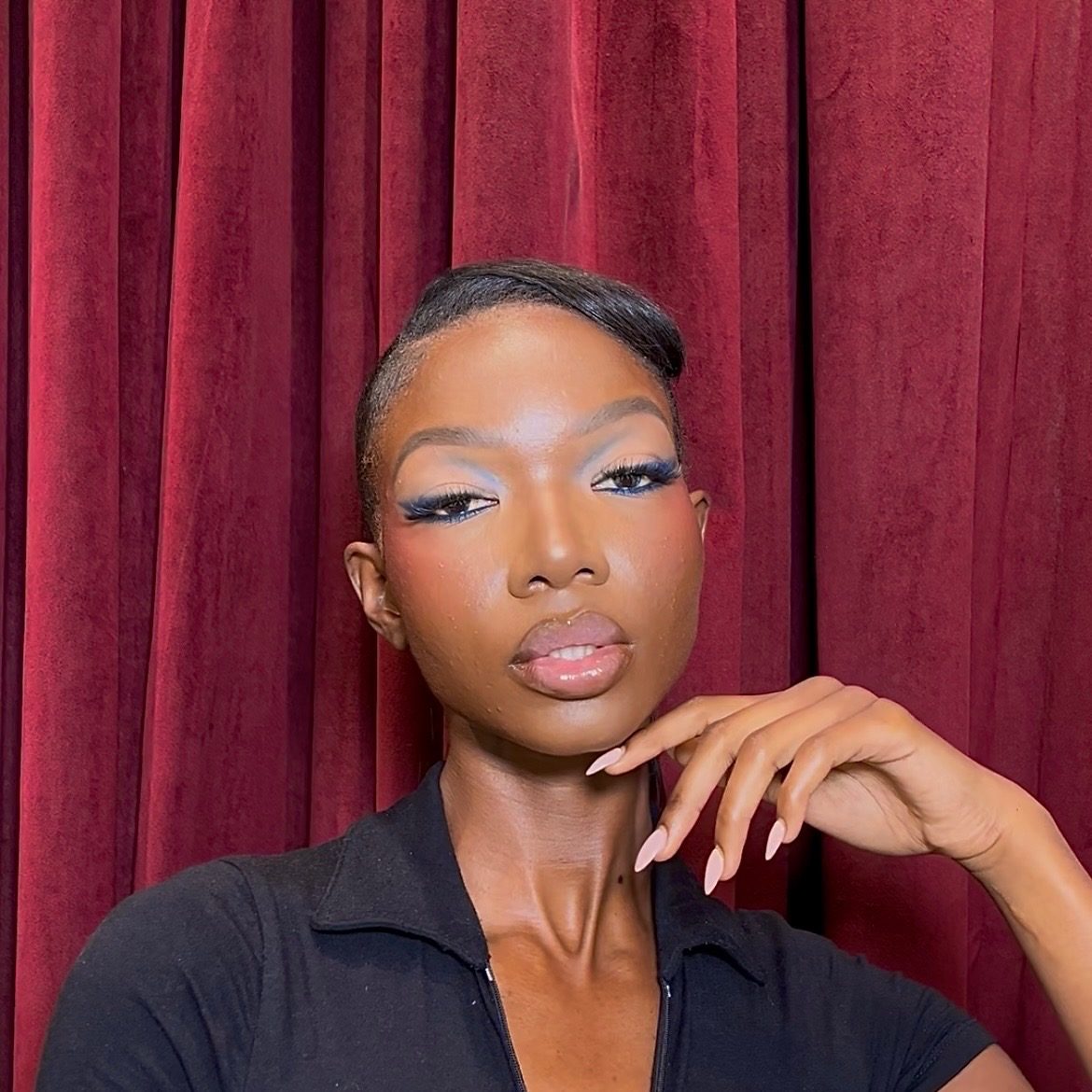 Editorial glam with red curtain backdrop